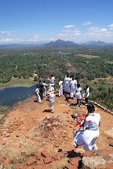 Image showing People on the top of rock