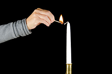 Image showing Lighting a candle