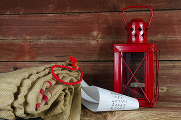 Image showing Santas equipment - burlap bag, wish list and lantern