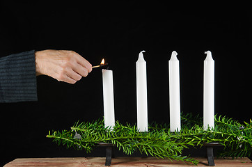 Image showing Lighting the first advent candle