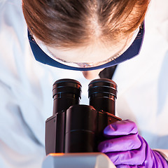 Image showing Researcher microscoping.