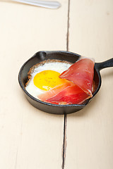 Image showing egg sunny side up with italian speck ham