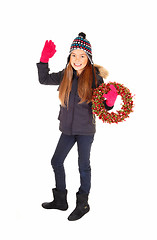 Image showing Girl with wreath waiving.