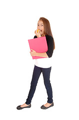 Image showing Blond girl eating apple.