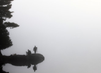 Image showing Sillouette Photographers in the mist