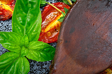 Image showing baked cherry tomatoes with basil and thyme