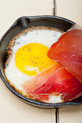 Image showing egg sunny side up with italian speck ham