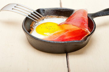 Image showing egg sunny side up with italian speck ham