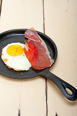 Image showing egg sunny side up with italian speck ham