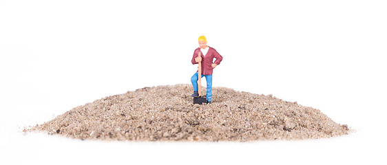 Image showing Miniature worker with a shovel