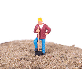 Image showing Miniature worker with a shovel