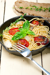 Image showing spaghetti pasta with baked cherry tomatoes and basil 