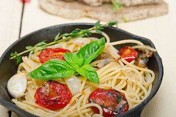 Image showing spaghetti pasta with baked cherry tomatoes and basil 