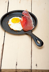 Image showing egg sunny side up with italian speck ham