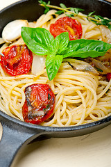 Image showing spaghetti pasta with baked cherry tomatoes and basil 