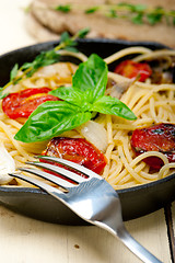 Image showing spaghetti pasta with baked cherry tomatoes and basil 