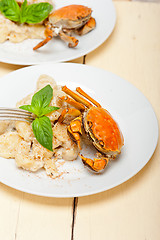 Image showing Italian gnocchi with seafood sauce with crab and basil