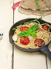 Image showing spaghetti pasta with baked cherry tomatoes and basil 