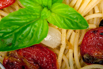 Image showing spaghetti pasta with baked cherry tomatoes and basil 