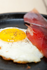 Image showing egg sunny side up with italian speck ham