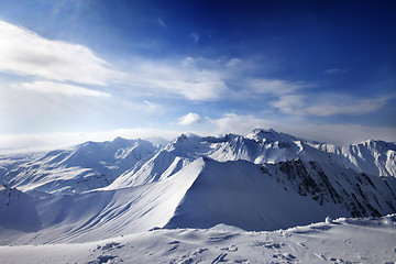 Image showing Snowy mountains and sunlight sky