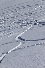 Image showing Traces of skis and snowboards in new-fallen snow 