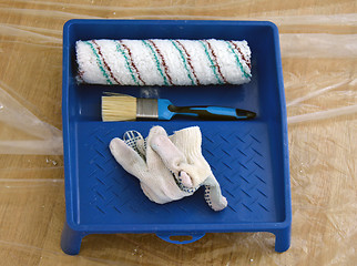 Image showing brush, gloves, roller and paint tray 