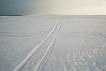 Image showing tracks on frozen snowcovered lake