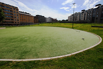 Image showing round green lawn in a residential area of Helsinki