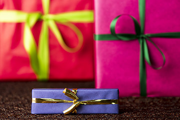 Image showing Three presents, bows and ribbons
