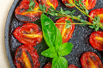 Image showing baked cherry tomatoes with basil and thyme