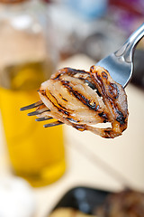 Image showing grilled onion on a fork