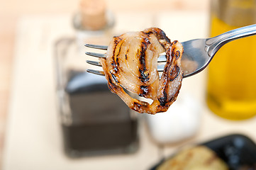 Image showing grilled onion on a fork