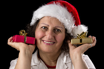 Image showing Gentle Aged Woman Holging Two Small Gifts