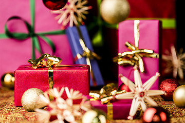 Image showing Red Present among other Gifts and Baubles