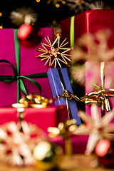 Image showing Blue Present amidst Straw Stars