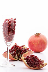 Image showing Pomegranate seeds and a whole Punica granatum
