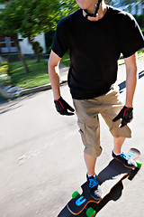 Image showing Teen Longboarding