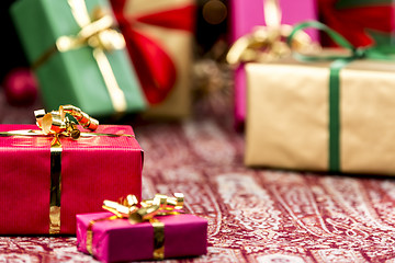 Image showing Red Present Among Other Gifts