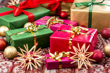 Image showing Xmas Presents with Bows, Baubles and Stars