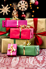 Image showing Stack of Plain Colored Xmas Gifts