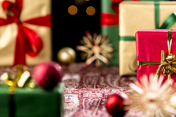 Image showing Christmas Gifts Placed on a Festive Cloth