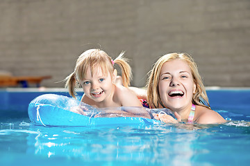 Image showing Attractive little girl and her mother