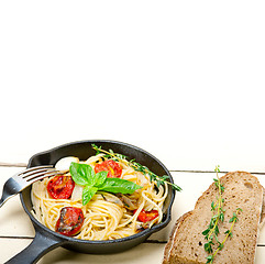 Image showing spaghetti pasta with baked cherry tomatoes and basil 