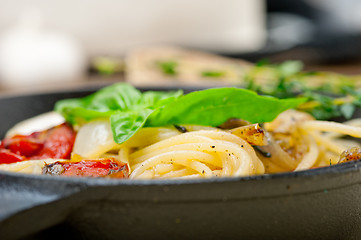 Image showing spaghetti pasta with baked cherry tomatoes and basil 