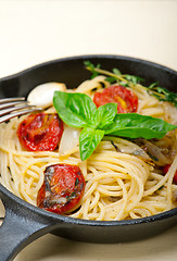 Image showing spaghetti pasta with baked cherry tomatoes and basil 