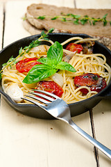 Image showing spaghetti pasta with baked cherry tomatoes and basil 