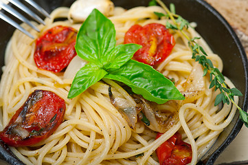 Image showing spaghetti pasta with baked cherry tomatoes and basil 