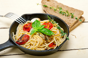 Image showing spaghetti pasta with baked cherry tomatoes and basil 