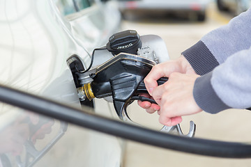 Image showing Petrol being pumped into a motor vehicle car.
